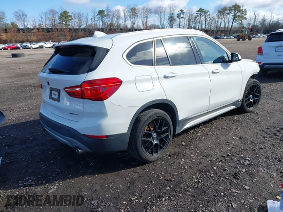 2018 BMW X1 xDrive28i with VIN WBXHT3C34J5L29714, listed as a IAAI auction lot 41825126 with 89,970 mi miles. Bid and sale history available at carsss.com. Image 4.