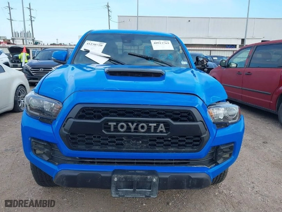 2019 Toyota Tacoma 4WD SR with VIN 5TFCZ5AN0KX199524, listed as a IAAI auction lot 41230720 with 91,183 mi miles. Bid and sale history available at carsss.com. Image 13.