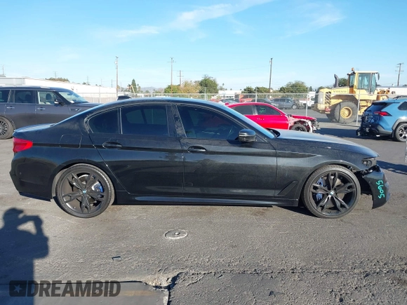 2019 BMW 5 Series M550i xDrive with VIN WBAJB9C51KB288416, listed as a IAAI auction lot 41265378 with 52,529 mi miles and . Bid and sale history available at DreamBid. Image 14.