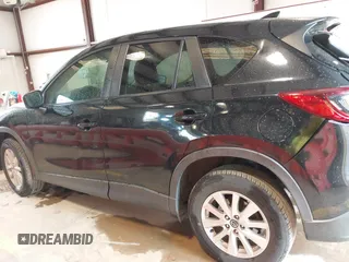 2016 Mazda CX-5 Touring with VIN JM3KE2CY7G0867355, listed as a IAAI auction lot 41963169 with 117,727 mi miles and . Bid and sale history available at DreamBid. Image 14.