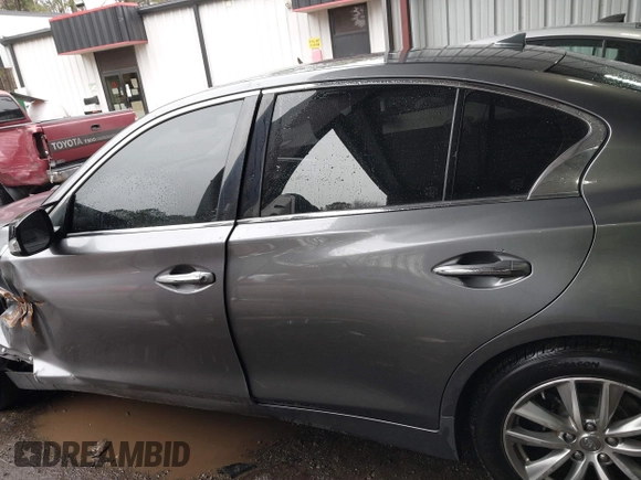 2015 Infiniti Q50 Premium z VIN JN1BV7ARXFM411040, wystawiony jako IAAI lot #41706295 z przebiegiem 97 297 mil mil oraz . Historia ofert i sprzedaży dostępna na DreamBid. Obrazek 14.