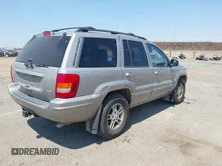 2000 Jeep Grand Cherokee Limited with VIN 1J4GW58N5YC361724, listed as a IAAI auction lot 42722980 with 136,590 mi miles and . Bid and sale history available at DreamBid. Image 4.
