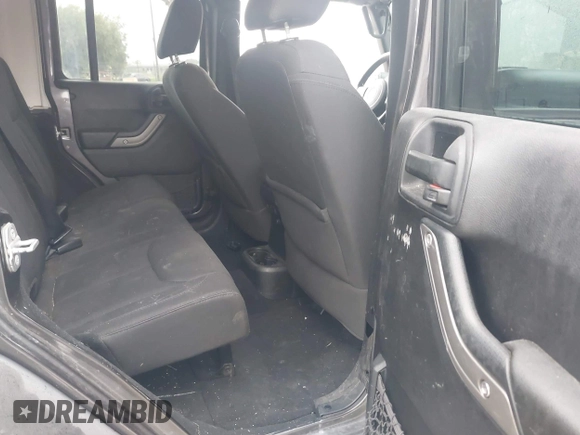 2014 Jeep Wrangler Unlimited Sport with VIN 1C4BJWDG7EL244749, listed as a IAAI auction lot 41871127 with 128,420 mi miles and . Bid and sale history available at DreamBid. Image 8.