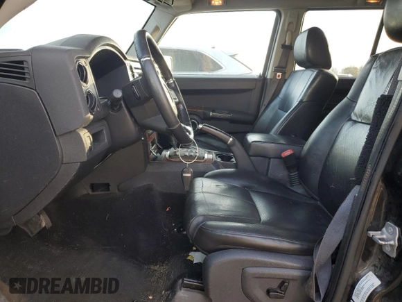 2010 Jeep Commander Limited with VIN 1J4RG5GT6AC113462, listed as a Copart auction lot 82400044 with 189,168 mi miles and Salvage title. Bid and sale history available at DreamBid. Image 7.