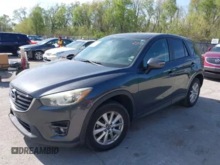 2016 Mazda CX-5 Touring z VIN JM3KE2CY4G0708972, wystawiony jako IAAI lot #42043013 z przebiegiem 157 573 mil mil oraz . Historia ofert i sprzedaży dostępna na DreamBid. Obrazek 2.