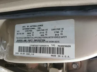 2001 Mazda 626 LX z VIN 1YVGF22C715202574, wystawiony jako Copart lot #54132915 z przebiegiem 237 041 mil mil oraz Szkody całkowita. Historia ofert i sprzedaży dostępna na DreamBid. Obrazek 13.