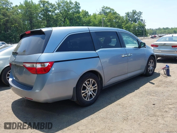 2011 Honda Odyssey EX-L with VIN 5FNRL5H60BB051135, listed as a IAAI auction lot 42588994 with 195,112 mi miles and . Bid and sale history available at DreamBid. Image 4.