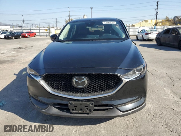 2021 Mazda CX-5 Touring with VIN JM3KFBCM8M0495899, listed as a Copart auction lot 51049235 with 31,164 mi miles and Salvage Title. Bid and sale history available at carsss.com. Image 5.
