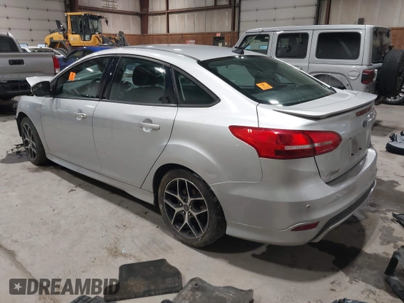 2015 Ford Focus SE with VIN 1FADP3F24FL272863, listed as a IAAI auction lot 41561084 with 103,875 mi miles. Bid and sale history available at carsss.com. Image 3.