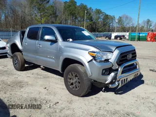 2023 Toyota Tacoma 4WD SR with VIN 3TMCZ5ANXPM609159, listed as a IAAI auction lot 41650165 with 14,987 mi miles. Bid and sale history available at carsss.com. Image 1.