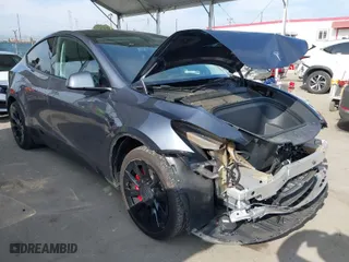 2023 Tesla Model Y Long Range with VIN 7SAYGAEE2PF851031, listed as a IAAI auction lot 42039393 with 21,398 mi miles. Bid and sale history available at carsss.com. Image 1.