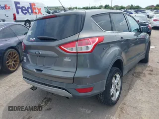 2014 Ford Escape SE z VIN 1FMCU9GX9EUC01478, wystawiony jako IAAI lot #42370409 z przebiegiem 158 154 mil mil oraz . Historia ofert i sprzedaży dostępna na DreamBid. Obrazek 4.