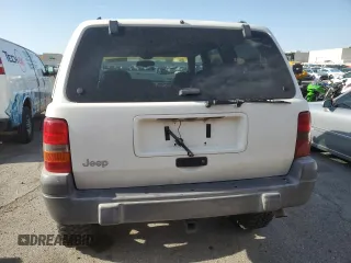 1998 Jeep Grand Cherokee Laredo with VIN 1J4GZ58S6WC319444, listed as a Copart auction lot 53147665 with 217,068 mi miles and Salvage Title. Bid and sale history available at carsss.com. Image 6.