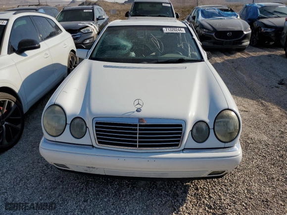 1999 Mercedes-Benz E-Class with VIN WDBJF70H5XA831773, listed as a Copart auction lot 71320244 with 145,181 mi miles and Salvage Title. Bid and sale history available at carsss.com. Image 5.