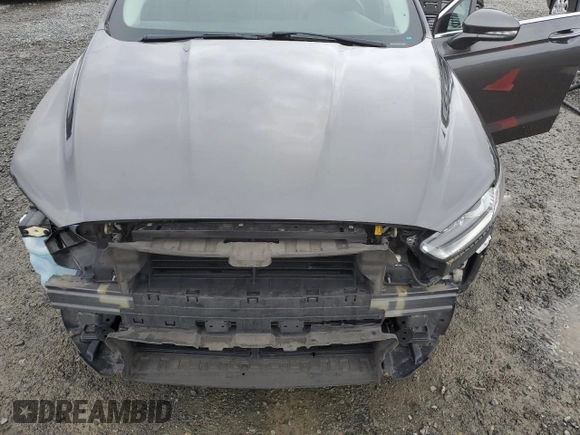 2015 Ford Fusion SE z VIN 3FA6P0H95FR206535, wystawiony jako Copart lot #54242105 z przebiegiem 83 001 mil mil oraz Szkoda całkowita • Salvage title. Historia ofert i sprzedaży dostępna na DreamBid. Obrazek 11.