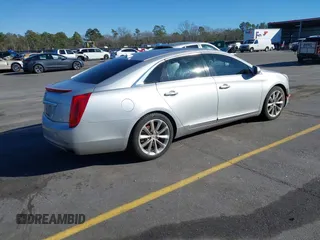 2013 Cadillac XTS Premium z VIN 2G61S5S35D9209252, wystawiony jako IAAI lot #41275066 z przebiegiem 132 311 mil mil oraz . Historia ofert i sprzedaży dostępna na DreamBid. Obrazek 4.