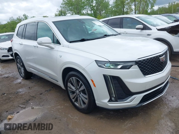 2021 Cadillac XT6 Premium Luxury z VIN 1GYKPDRS0MZ141453, wystawiony jako IAAI lot #42215954 z przebiegiem 144 245 mil mil oraz . Historia ofert i sprzedaży dostępna na DreamBid. Obrazek 1.