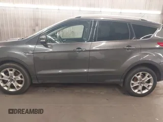 2015 Ford Escape Titanium with VIN 1FMCU9J96FUA43337, listed as a IAAI auction lot 41825328 with 149,639 mi miles and . Bid and sale history available at DreamBid. Image 15.