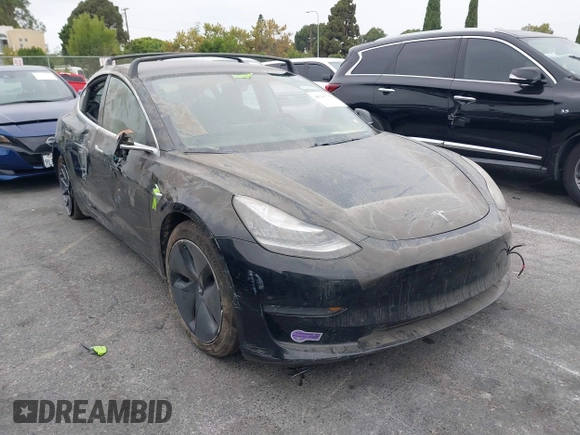 2019 Tesla Model 3 Mid Range with VIN 5YJ3E1EA2KF362048, listed as a IAAI auction lot 40141734 with 70,321 mi miles and . Bid and sale history available at carsss.com. Image 1.