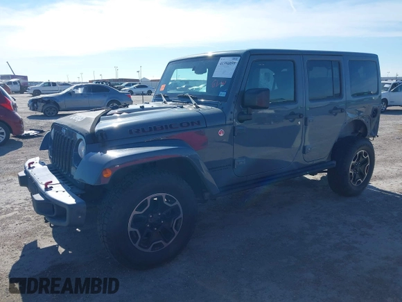 2015 Jeep Wrangler Unlimited Rubicon with VIN 1C4BJWFG7FL525724, listed as a IAAI auction lot 41394059 with 132,058 mi miles. Bid and sale history available at carsss.com. Image 2.
