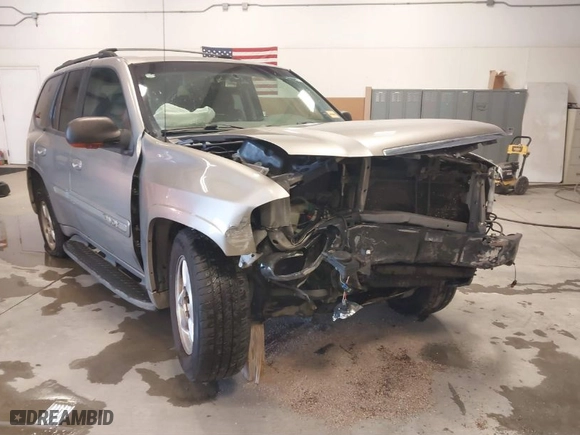 2003 GMC Envoy SLT with VIN 1GKDS13S932299354, listed as a IAAI auction lot 41238557 with 251,535 mi miles. Bid and sale history available at carsss.com. Image 6.