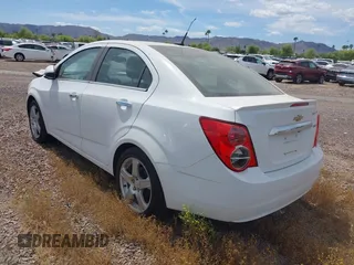 2014 Chevrolet Sonic LTZ with VIN 1G1JE5SB4E4227749, listed as a IAAI auction lot 38965556 with 69,550 mi miles. Bid and sale history available at carsss.com. Image 3.