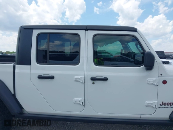 2024 Jeep Gladiator Rubicon z VIN 1C6JJTBG5RL110865, wystawiony jako IAAI lot #42104829 z przebiegiem 6 815 mil mil oraz . Historia ofert i sprzedaży dostępna na DreamBid. Obrazek 13.
