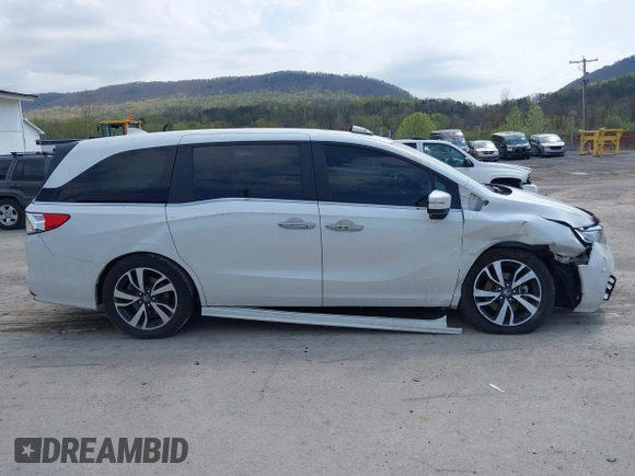 2021 Honda Odyssey Touring with VIN 5FNRL6H80MB010952, listed as a IAAI auction lot 42080412 with 90,594 mi miles and . Bid and sale history available at DreamBid. Image 13.