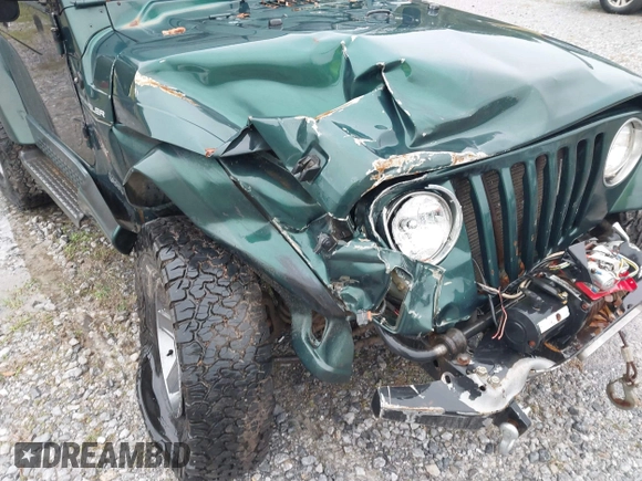 2000 Jeep Wrangler Sahara with VIN 1J4FA59SXYP701098, listed as a IAAI auction lot 41592872 with 1 mi miles. Bid and sale history available at carsss.com. Image 6.