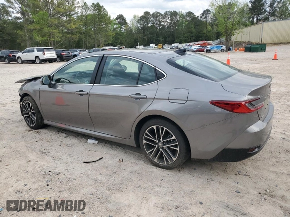 2025 Toyota Camry LE with VIN 4T1DAACKXSU556874, listed as a Copart auction lot 52694525 with 7,076 mi miles and Salvage Title. Bid and sale history available at carsss.com. Image 2.