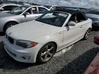 2012 BMW 1 Series 128i with VIN WBAUL7C54CVM83585, listed as a Copart auction lot 74215044 with 0 mi miles and Salvage Title. Bid and sale history available at carsss.com. Image 1.