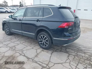 2021 Volkswagen Tiguan SE with VIN 3VV2B7AXXMM057849, listed as a IAAI auction lot 41879768 with 88,353 mi miles and . Bid and sale history available at DreamBid. Image 3.