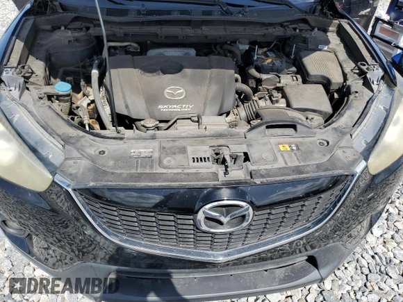 2014 Mazda CX-5 Touring z VIN JM3KE2CY8E0326988, wystawiony jako Copart lot #60473715 z przebiegiem 231 055 mil mil oraz Czysty tytuł • Clean title. Historia ofert i sprzedaży dostępna na DreamBid. Obrazek 12.