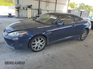 2008 Hyundai Tiburon GT z VIN KMHHN66FX8U280481, wystawiony jako Copart lot #52960165 z przebiegiem 133 063 mil mil oraz Nie do naprawy • Non repairable. Historia ofert i sprzedaży dostępna na DreamBid. Obrazek 1.