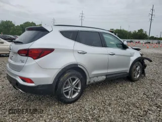 2017 Hyundai Santa Fe 2.4L z VIN 5XYZUDLB8HG500297, wystawiony jako Copart lot #58005165 z przebiegiem 91 871 mil mil oraz Szkoda całkowita • Salvage title. Historia ofert i sprzedaży dostępna na DreamBid. Obrazek 3.