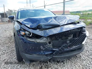 2021 Mazda CX-30 Premium z VIN 3MVDMBDL7MM236474, wystawiony jako IAAI lot #42284515 z przebiegiem 58 565 mil mil oraz . Historia ofert i sprzedaży dostępna na DreamBid. Obrazek 6.