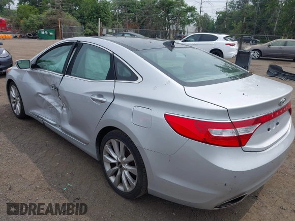 2014 Hyundai Azera Limited z VIN KMHFH4JG0EA396451, wystawiony jako IAAI lot #42493447 z przebiegiem 166 810 mil mil oraz . Historia ofert i sprzedaży dostępna na DreamBid. Obrazek 3.