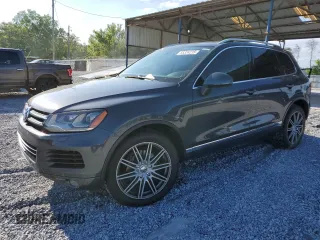 2011 Volkswagen Touareg Sport z VIN WVGFF9BP2BD004906, wystawiony jako Copart lot #55324235 z przebiegiem 133 637 mil mil oraz Szkody całkowita. Historia ofert i sprzedaży dostępna na DreamBid. Obrazek 1.
