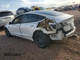 2021 Tesla Model 3 Standard Range Plus with VIN 5YJ3E1EA2MF923156, listed as a Copart auction lot 50098135 with 50,917 mi miles and Salvage Title. Bid and sale history available at carsss.com. Image 2.