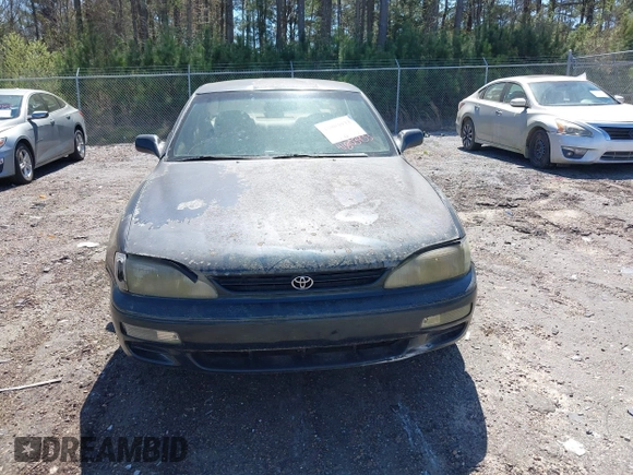 1995 Toyota Camry LE with VIN 4T1GK12E5SU860216, listed as a IAAI auction lot 41803933 with 235,130 mi miles. Bid and sale history available at carsss.com. Image 6.
