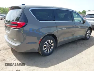 2023 Chrysler Pacifica Hybrid Touring L with VIN 2C4RC1L73PR522988, listed as a IAAI auction lot 42280263 with 54,939 mi miles and . Bid and sale history available at DreamBid. Image 4.