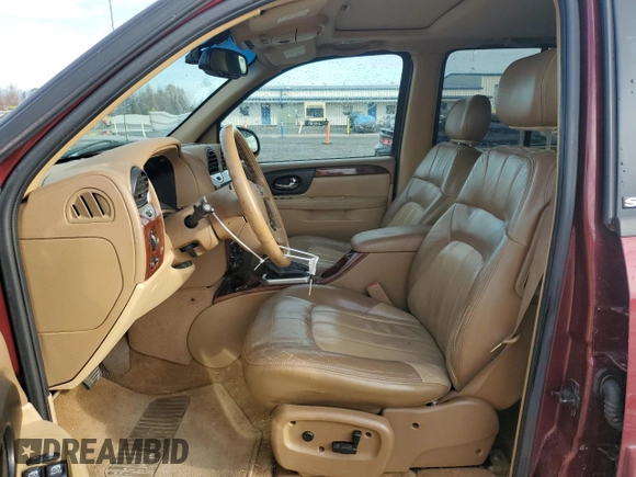 2003 GMC Envoy SLT with VIN 1GKDT13S032245485, listed as a Copart auction lot 84385304 with 139,183 mi miles and Salvage Title. Bid and sale history available at carsss.com. Image 7.