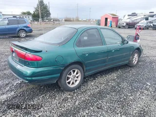 1999 Ford Contour SE Fleet with VIN 1FAFP66L3XK227522, listed as a IAAI auction lot 41702873 with 140,926 mi miles. Bid and sale history available at carsss.com. Image 4.