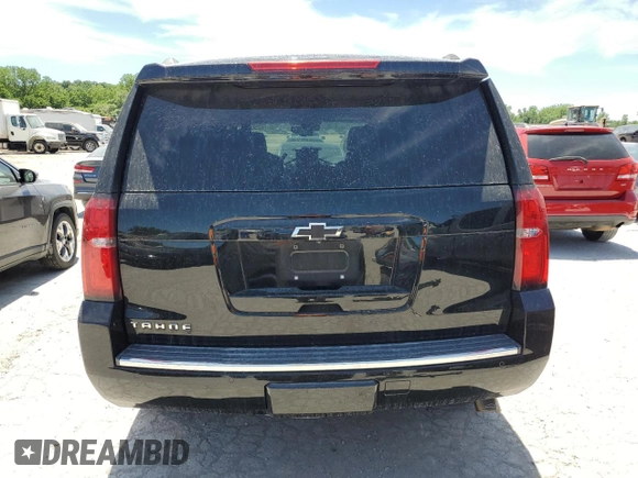2015 Chevrolet Tahoe LTZ z VIN 1GNSKCKC8FR506151, wystawiony jako Copart lot #59948174 z przebiegiem Nie podano mil oraz Szkoda całkowita • Salvage title. Historia ofert i sprzedaży dostępna na DreamBid. Obrazek 6.