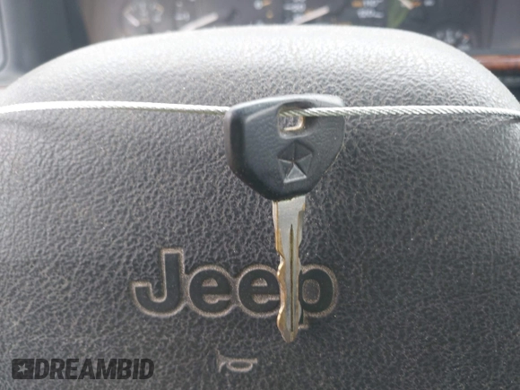 1998 Jeep Grand Cherokee Limited z VIN 1J4GZ78Y5WC261391, wystawiony jako IAAI lot #42275913 z przebiegiem 180 552 mil mil oraz . Historia ofert i sprzedaży dostępna na DreamBid. Obrazek 11.