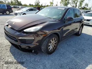 2014 Porsche Cayenne z VIN WP1AA2A20ELA05832, wystawiony jako Copart lot #56009045 z przebiegiem 127 507 mil mil oraz Czysty tytuł • Clean title. Historia ofert i sprzedaży dostępna na DreamBid. Obrazek 1.