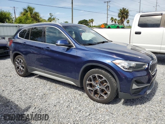 2020 BMW X1 xDrive28i with VIN WBXJG9C0XL5R33141, listed as a Copart auction lot 63040155 with 165,172 mi miles and Clean title. Bid and sale history available at DreamBid. Image 4.