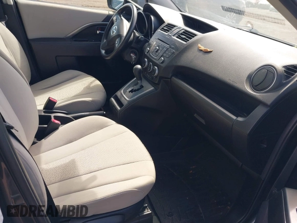 2012 Mazda 5 Sport with VIN JM1CW2BL4C0107491, listed as a IAAI auction lot 42191489 with 108,411 mi miles and . Bid and sale history available at DreamBid. Image 5.
