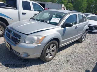 2011 Dodge Caliber Mainstreet with VIN 1B3CB3HAXBD107494, listed as a IAAI auction lot 42071328 with 146,936 mi miles. Bid and sale history available at carsss.com. Image 2.
