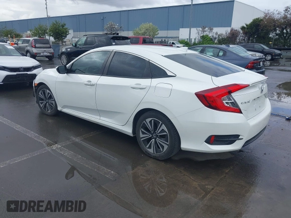 2017 Honda Civic EX-L z VIN 2HGFC1F79HH635156, wystawiony jako IAAI lot #41922115 z przebiegiem 142 565 mil mil oraz . Historia ofert i sprzedaży dostępna na DreamBid. Obrazek 3.